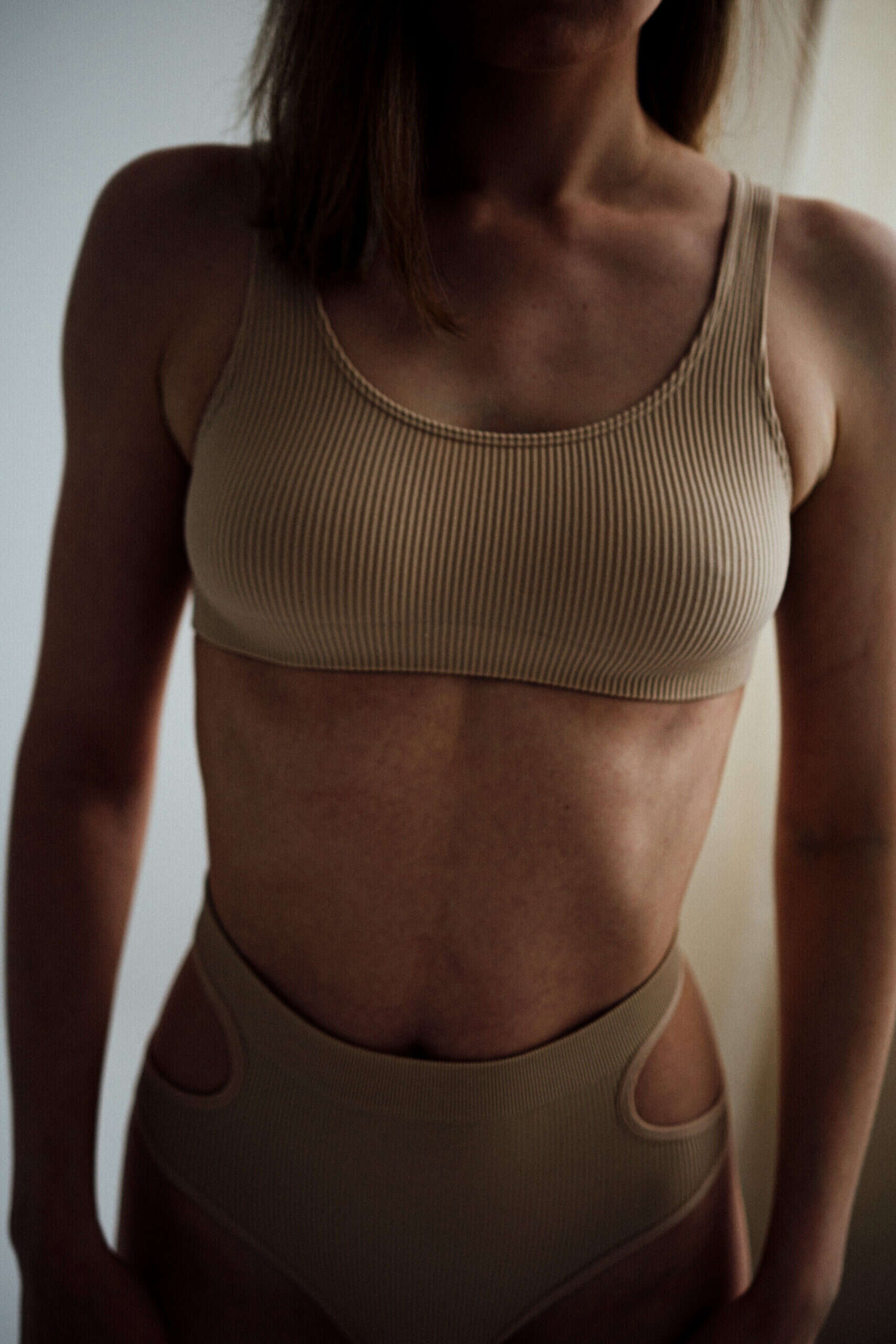 midsection-woman-standing-home